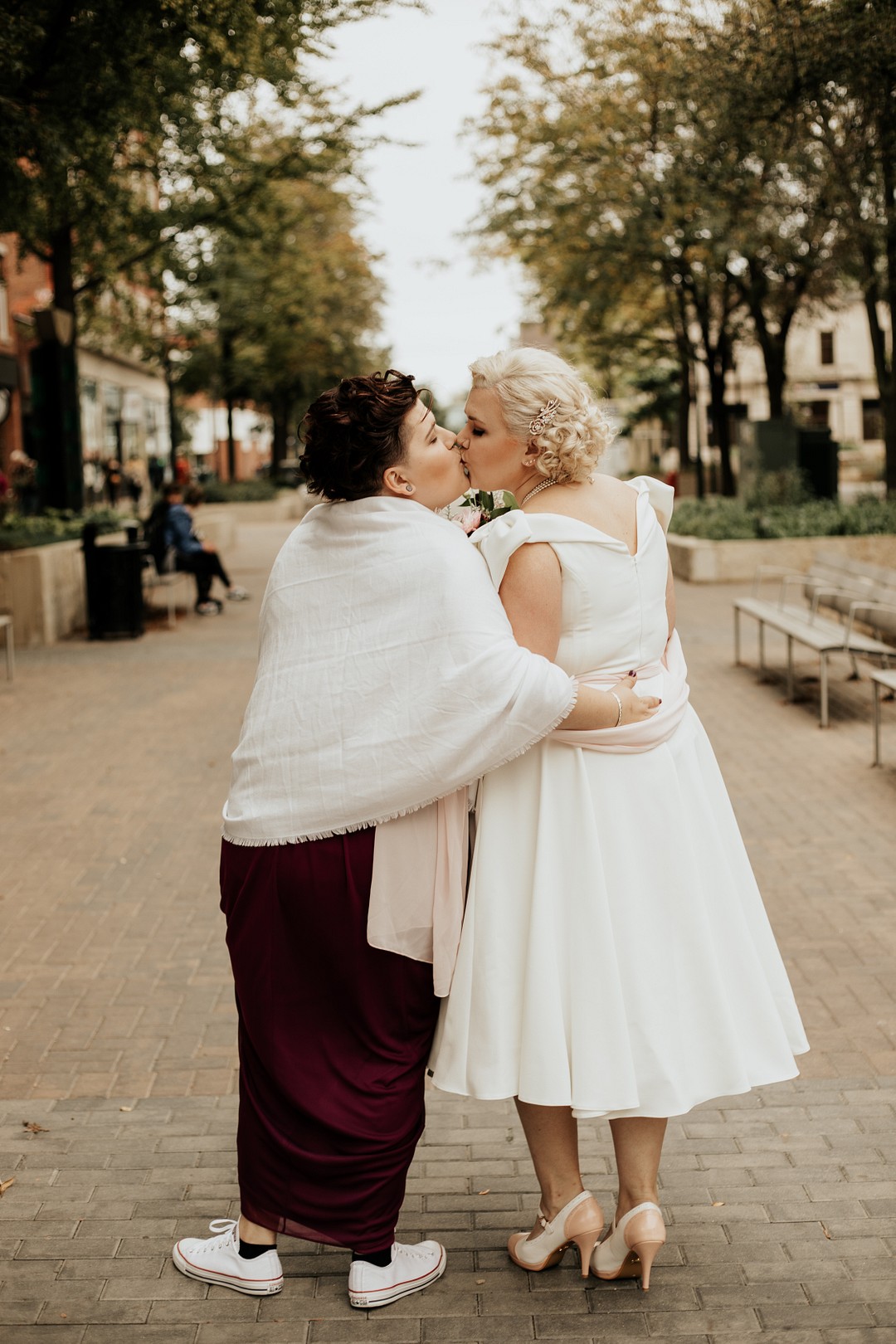 Vintage travel-inspired fall wedding in Iowa City, Iowa LGBTQ+ weddings lesbian wedding two brides alternative wedding