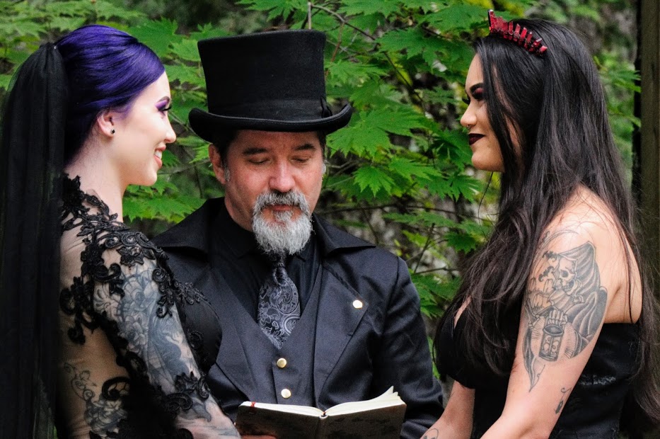 Black gothic wedding with skulls, swords and magic LGBTQ+ weddings lesbian two brides all-black alternative vows