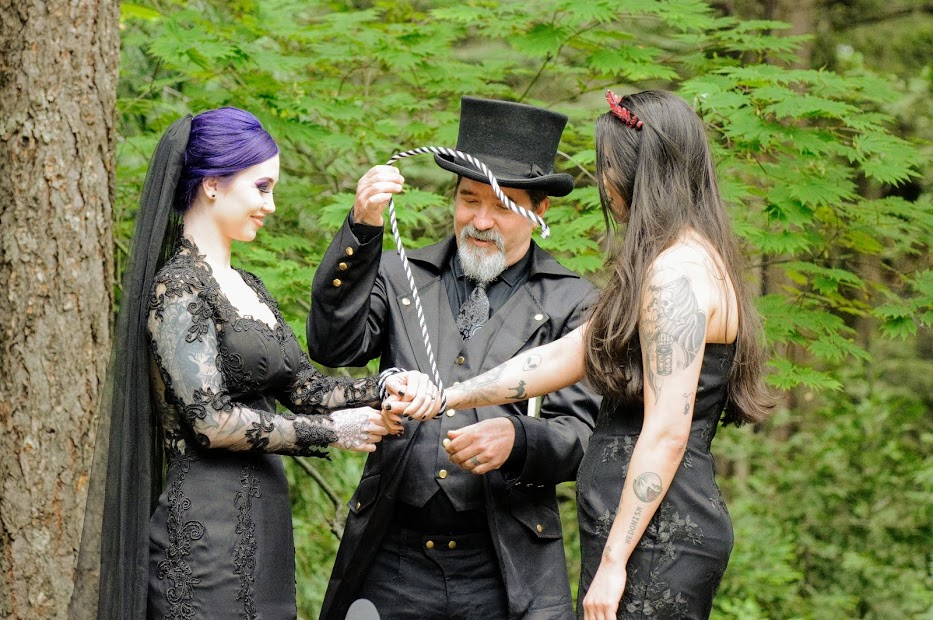 Black gothic wedding with skulls, swords and magic LGBTQ+ weddings lesbian two brides all-black alternative