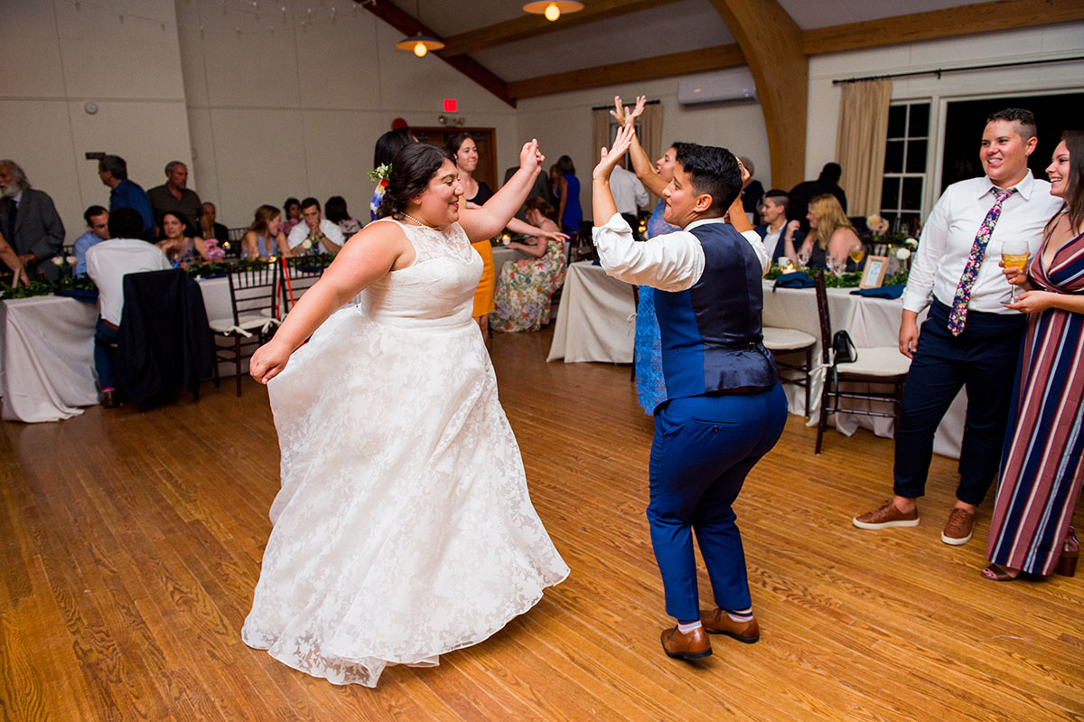 Community was at the heart of this floral summer wedding LGBTQ+ weddings two brides queer lesbian wedding Long Island New York Bindle and Keep first dance
