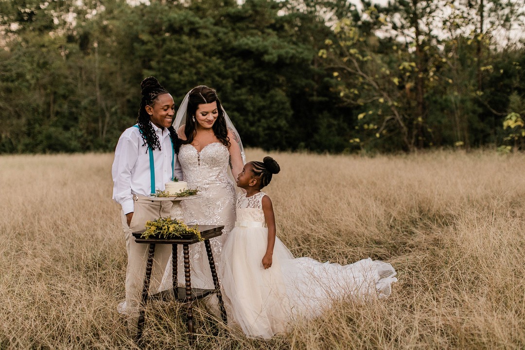 Bohemian winter elopement photos in Irmo, South Carolina LGBTQ+ weddings kiss elope intimate wedding celebration inspiration styled shoot real couple two brides daughter