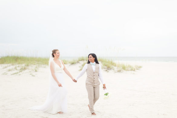 Tropical blue and green beach wedding in St. Petersburg, Florida two brides lesbian wedding white dress tan suit destination LGBTQ+ weddings