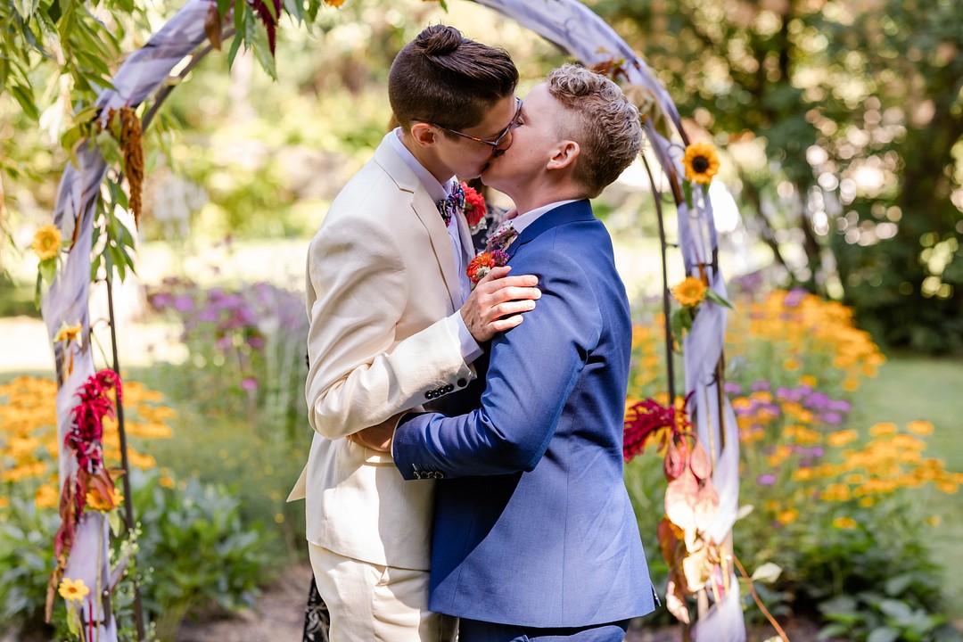 Intimate, rustic summer garden wedding at Josias River Farm LGBTQ+ weddings small wedding nonbinary queer wedding vows kiss