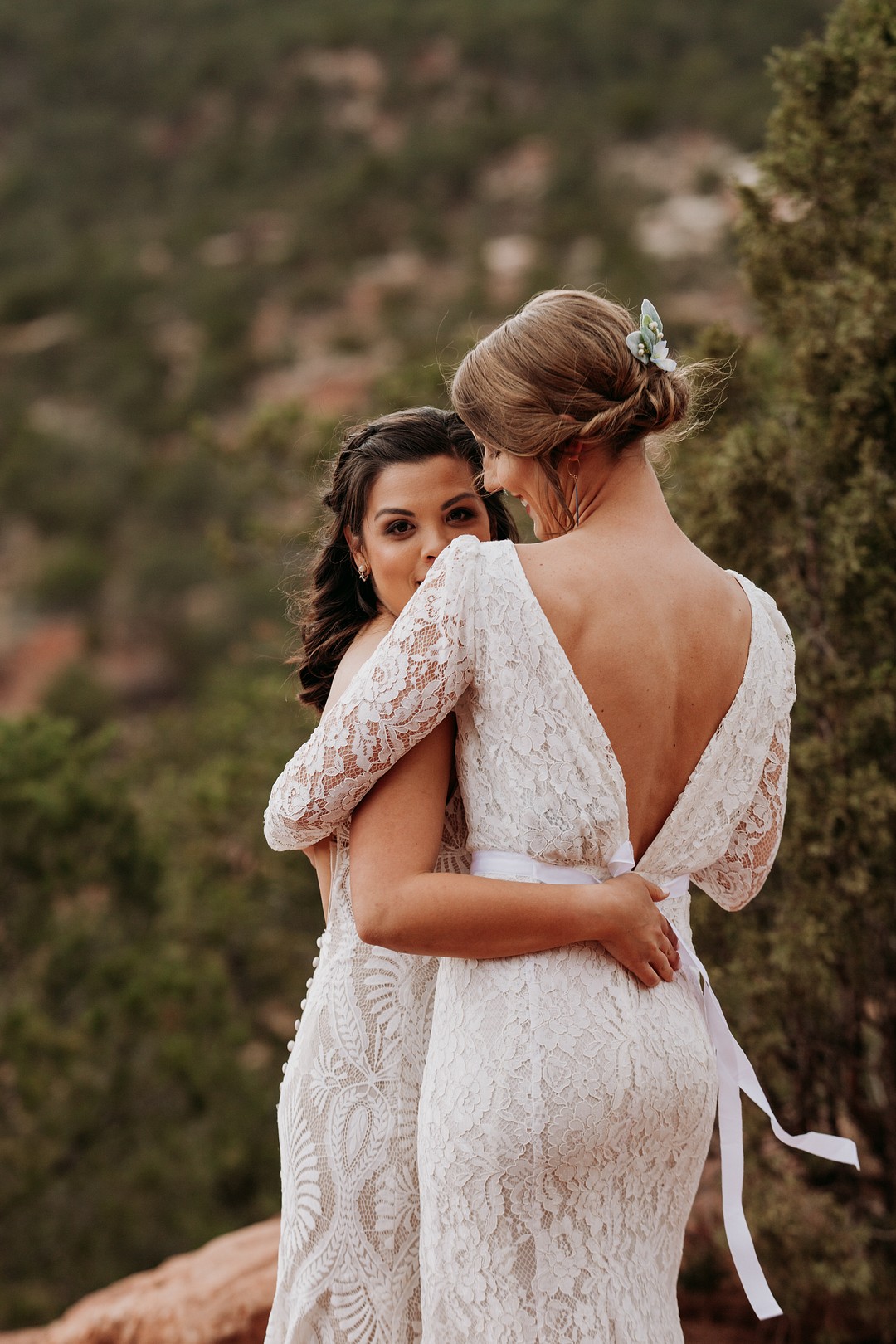 Epic spring Garden of the Gods elopement with dog attendants LGBTQ+ weddings intimate lesbian wedding two brides dogs sandstone formation cliffs