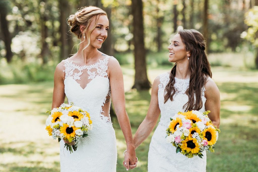 Rustic, elegant early fall wedding in Sabillasville, Maryland LGBTQ+ weddings lesbian wedding two brides long white dresses outdoors South Carolina Southern September wedding sunflowers