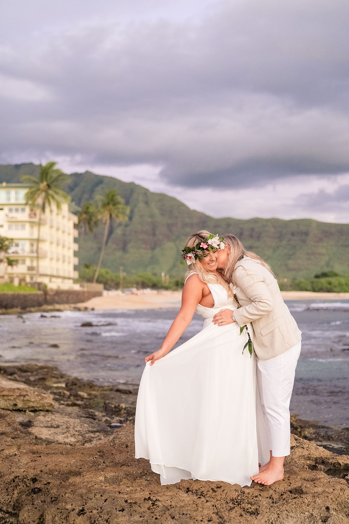Colorful, floral tropical beach destination wedding in Makaha, Hawaii LGBTQ+ weddings lesbian wedding two brides birds of paradise ocean
