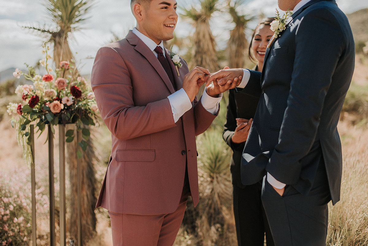 Floral bohemian elopement inspiration at Joshua Tree LGBTQ+ weddings gay wedding two grooms models National Park California vows