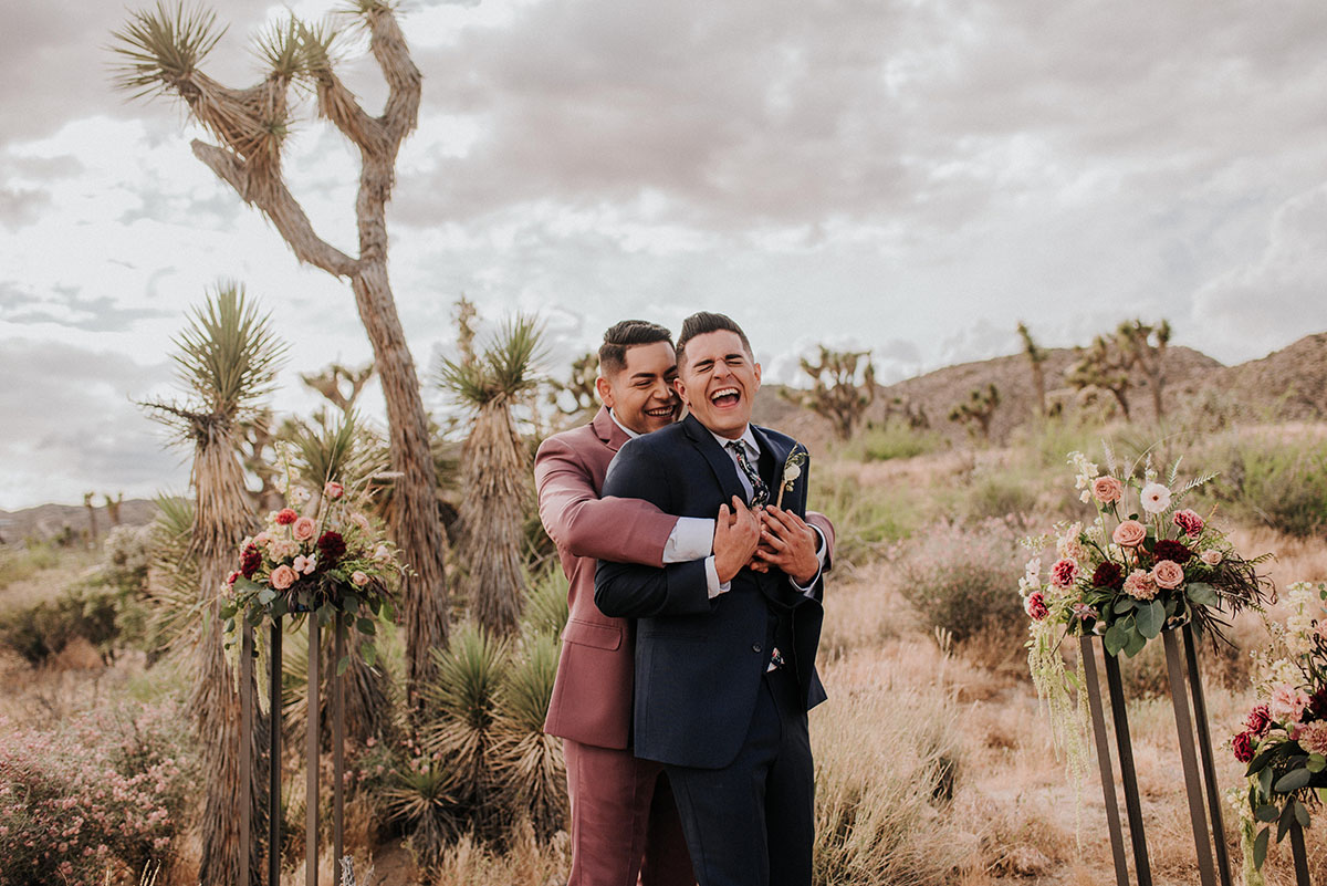 Floral bohemian elopement inspiration at Joshua Tree LGBTQ+ weddings gay wedding two grooms models National Park California
