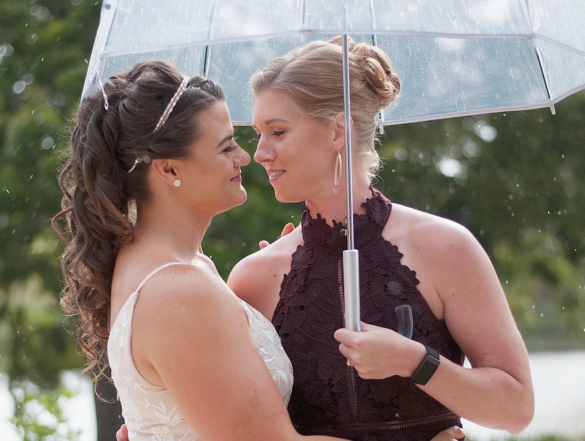 Casual countryside wedding reception a year after courthouse wedding LGBTQ+ weddings lesbian wedding Texas rain
