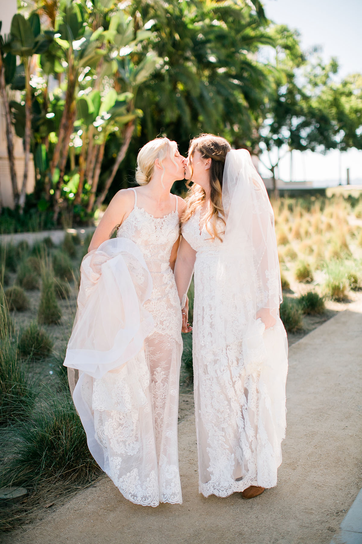 Whimsical, rustic waterfront wedding in San Diego, California two brides LGBTQ+ weddings sunny succulents kiss