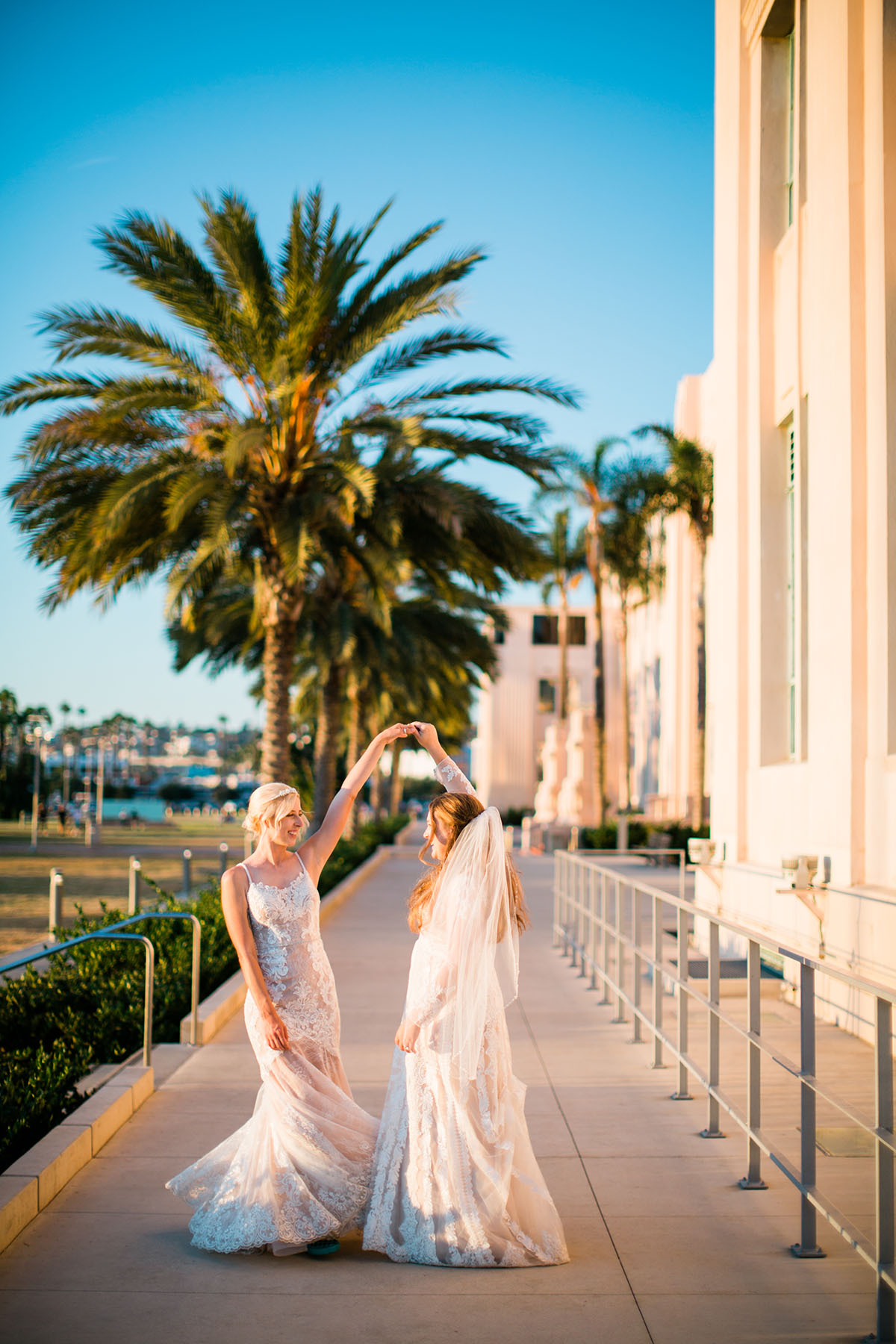 Whimsical, rustic waterfront wedding in San Diego, California two brides LGBTQ+ weddings sunny succulents dance palm tree