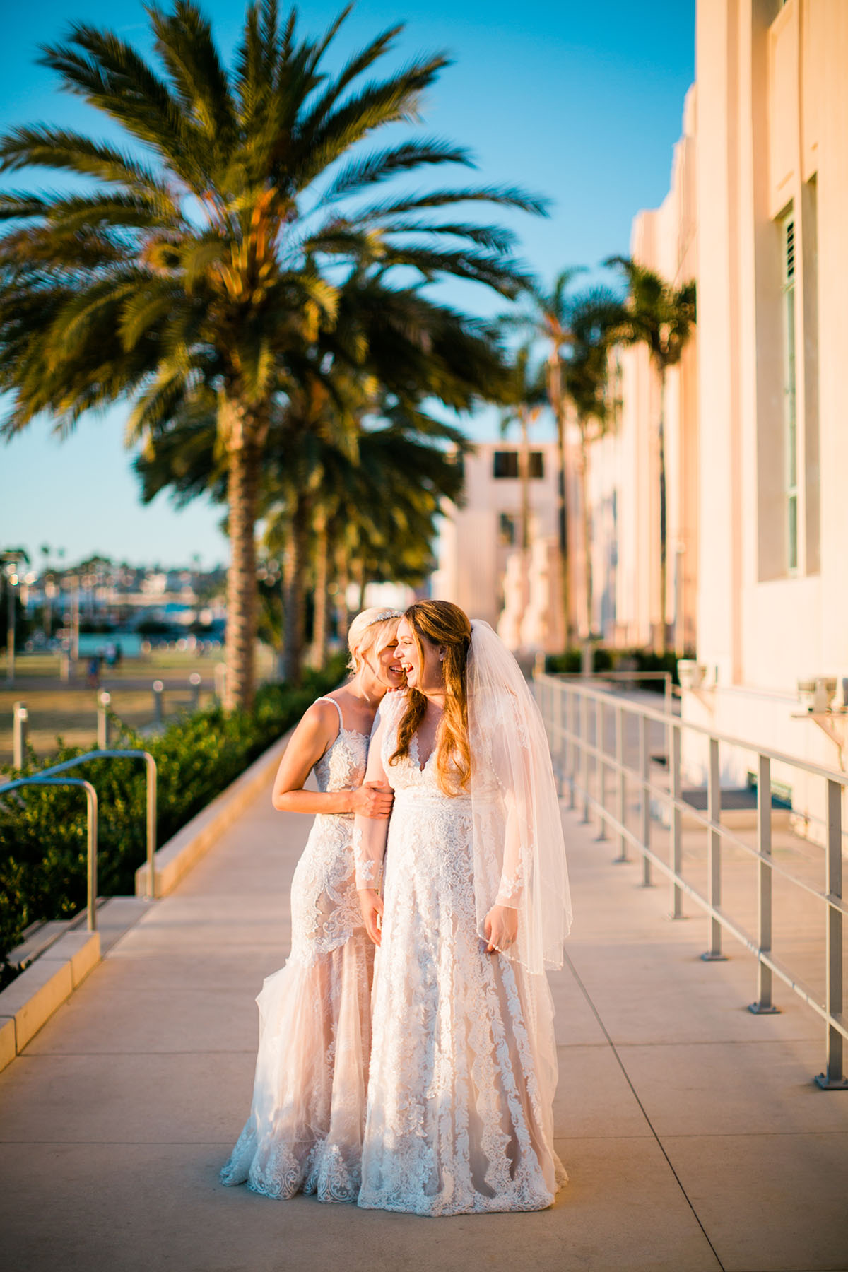 Whimsical, rustic waterfront wedding in San Diego, California two brides LGBTQ+ weddings sunny succulents sunset palm tree