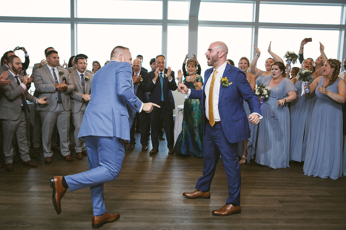 Waterfront brewery elopement at The Piermont in Babylon, New York LGBTQ+ weddings two grooms gay wedding succulents beach terrariums blue tuxedos dance