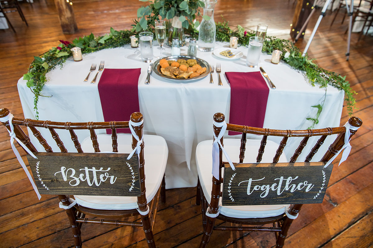 Rustic mountain wedding at The Red Barn at Hampshire College LGBTQ+ weddings two brides Amherst Massachusetts romantic cozy table
