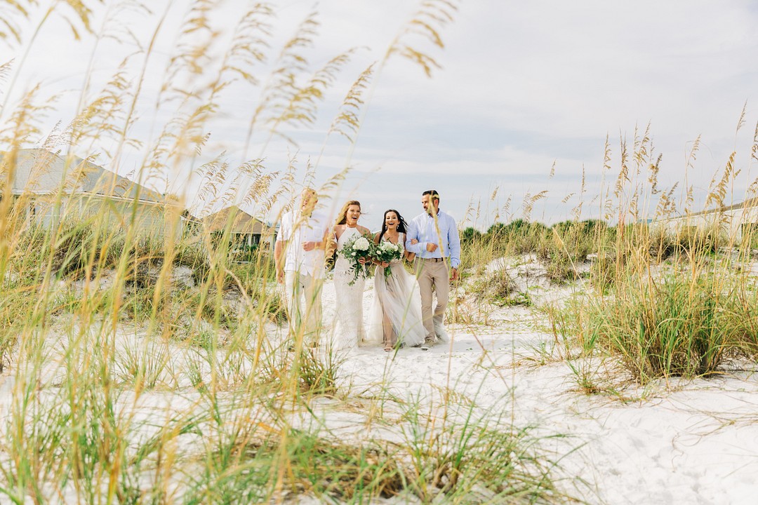 Carefree bohemian beach wedding in Pensacola, Florida LGBTQ+ weddings two brides