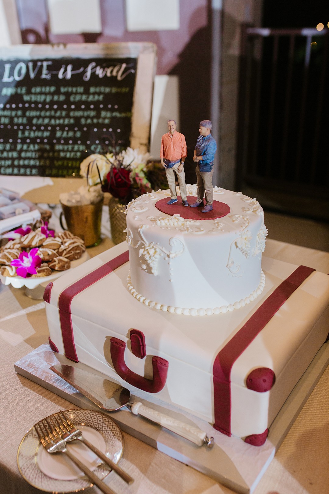 After 20 years, two grooms celebrate with whimsical winery wedding LGBTQ+ weddings aerialist gay wedding purple tux gold glitter tux fall California wedding wine country cake travel suitcase