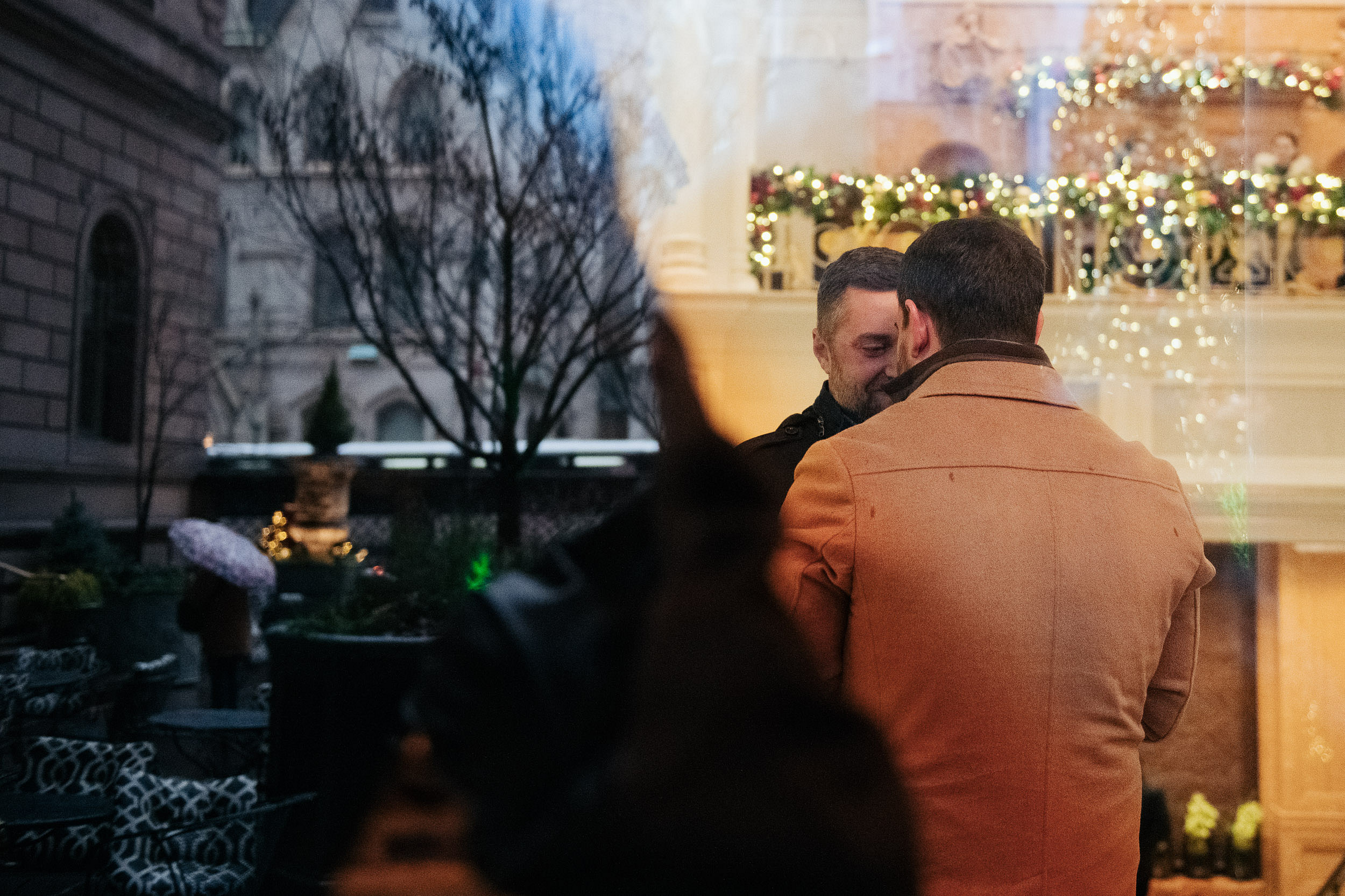 Romantic Christmas proposal in Lotte Hotel in New York, New York LGBTQ+ weddings engagement engaged proposal Manhattan NYC rainy rain
