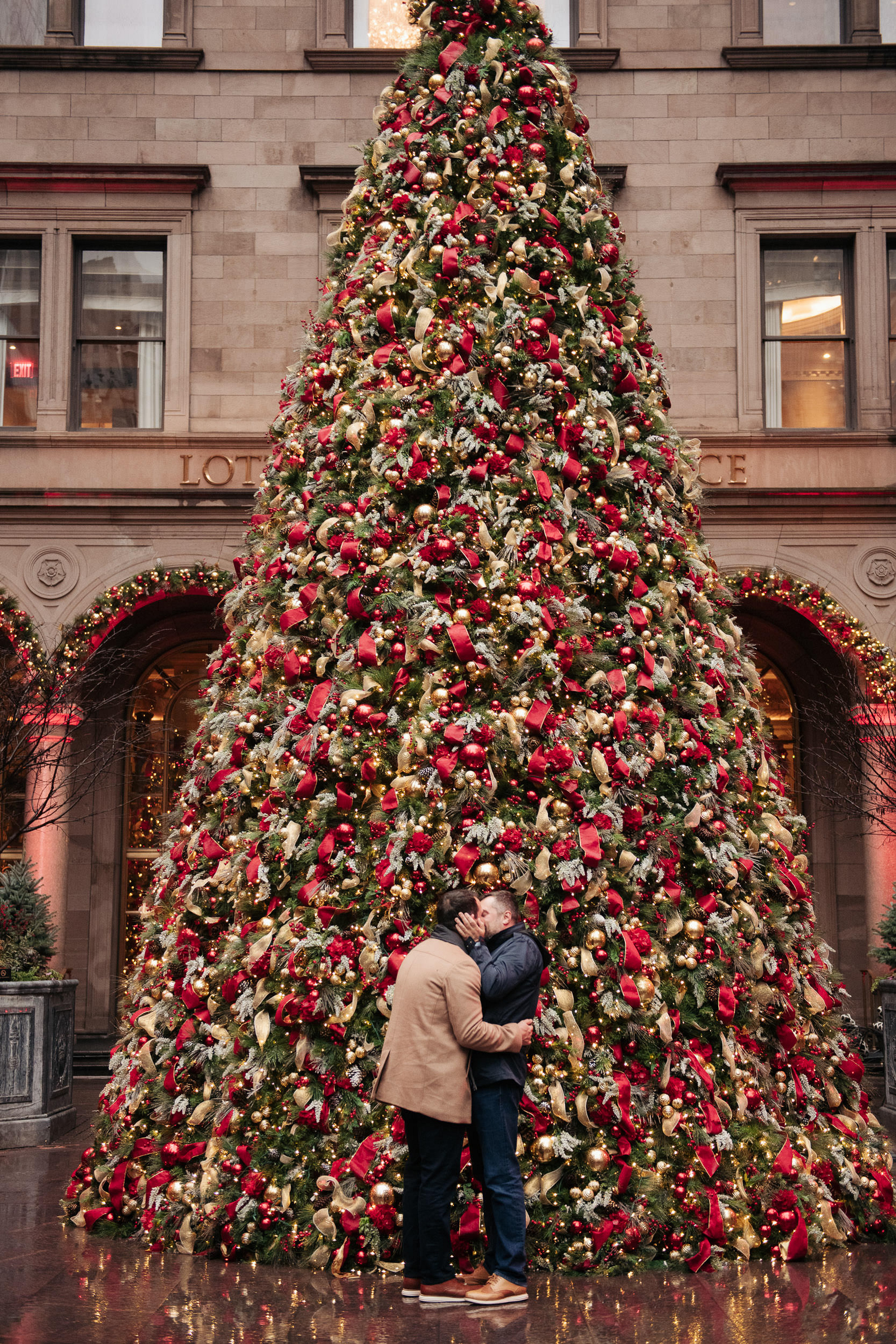 Romantic Christmas proposal in Lotte Hotel in New York, New York LGBTQ+ weddings engagement engaged proposal Manhattan NYC rainy rain