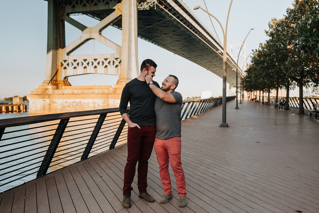 Urban summer engagement photos in Philadelphia, Pennsylvania LGBTQ+ weddings two grooms city engaged