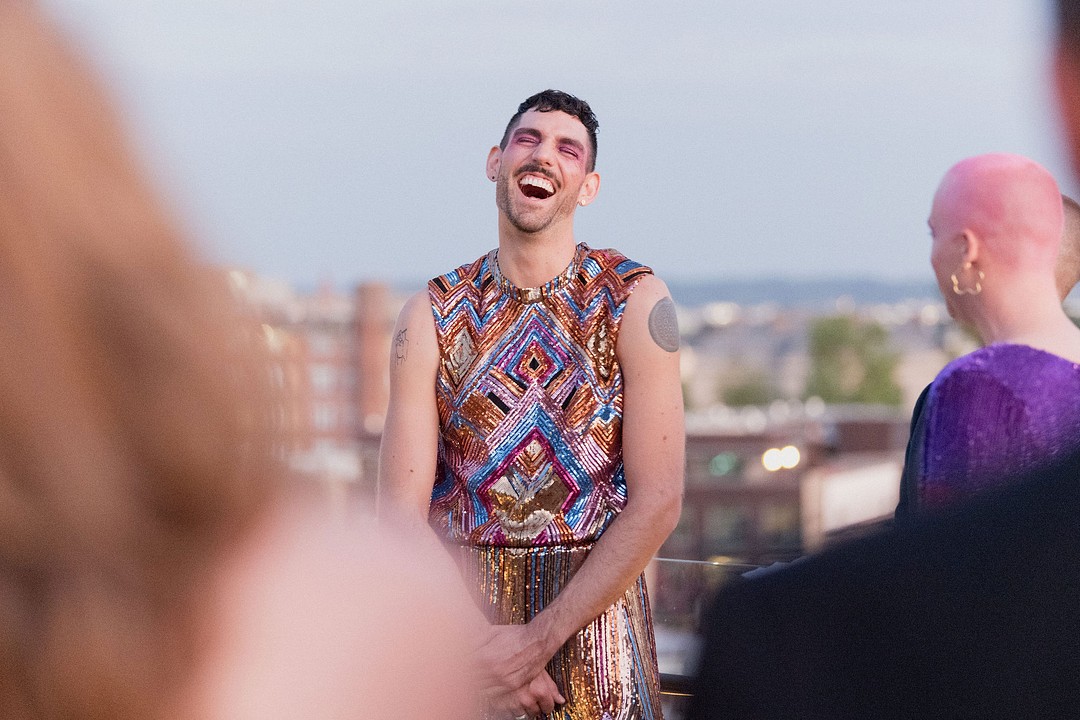 Rainbow, flowers and sequins rooftop wedding in Washington, D.C. LGBTQ+ weddings glitter nontraditional unique