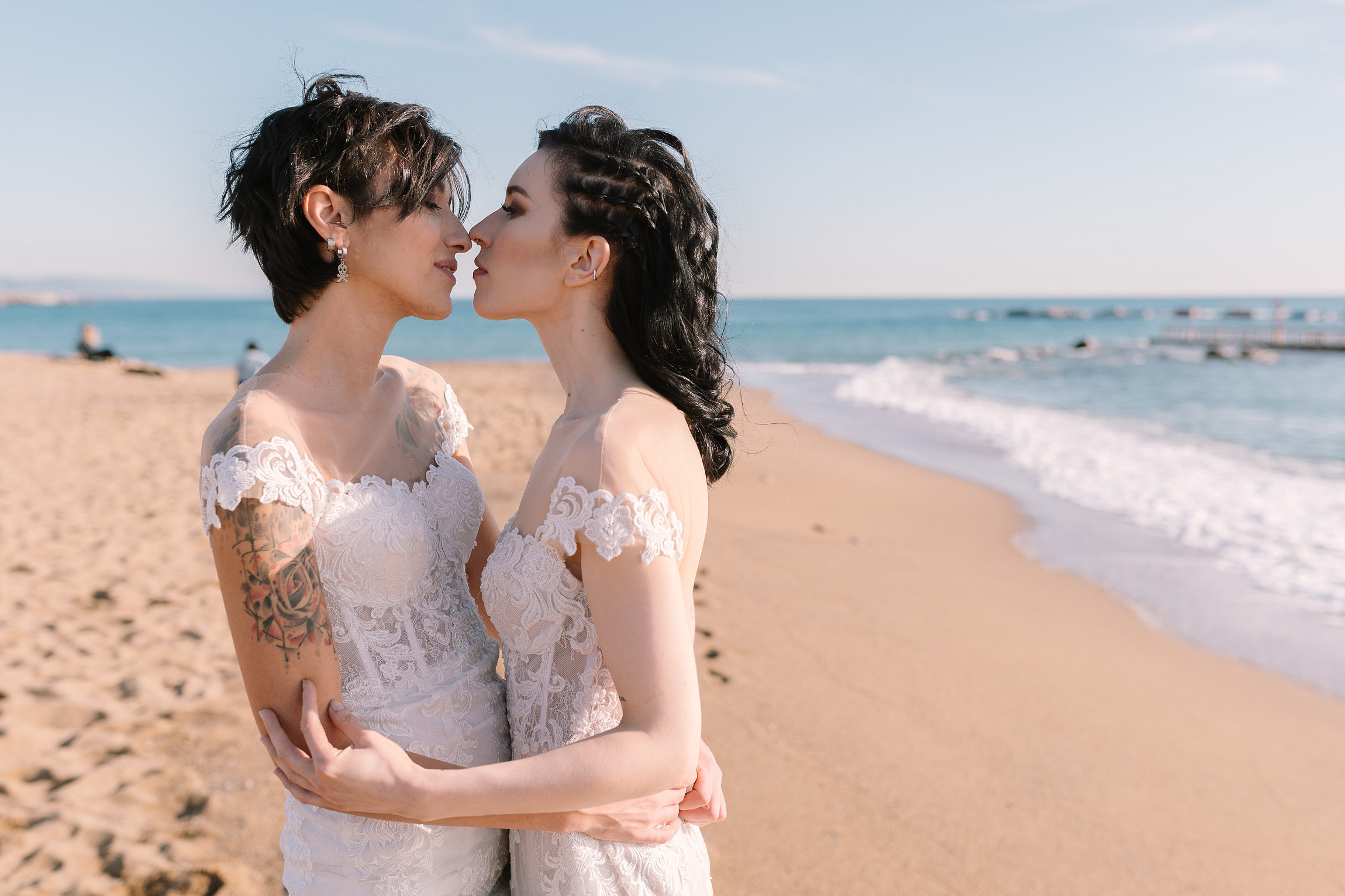 Romantic winter beach wedding in Barcelona, Spain LGBTQ+ weddings destination elopement two brides lesbian