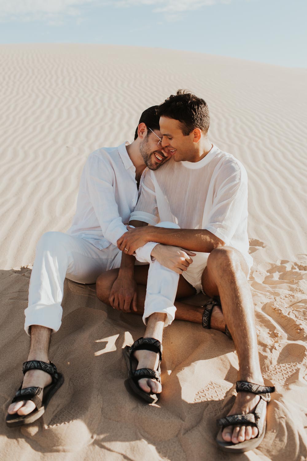 Monochrome winter engagement session at California sand dunes | Photo by Liz Erban LGBTQ weddings and engagements Equally Wed
