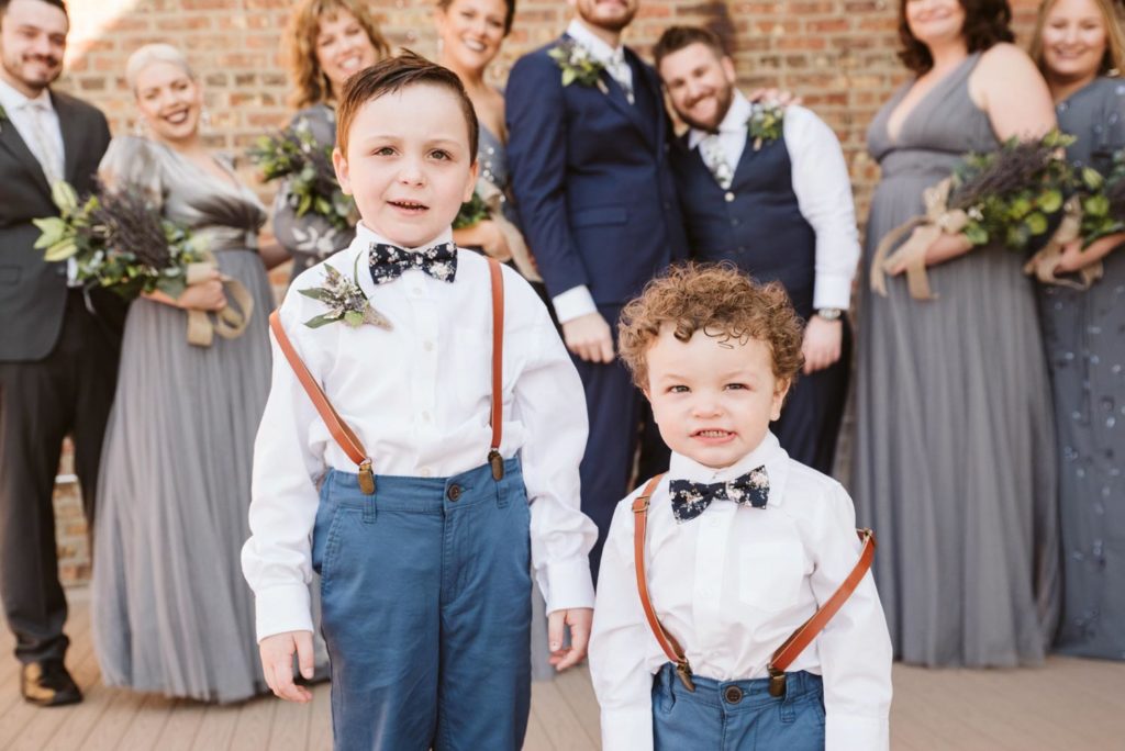 David + Andrew: Midwestern Pride Wedding Giveaway winners marry Photo Glass & Grain Photography published on Equally Wed, the world's leading LGBTQ+ wedding magazine child attendants