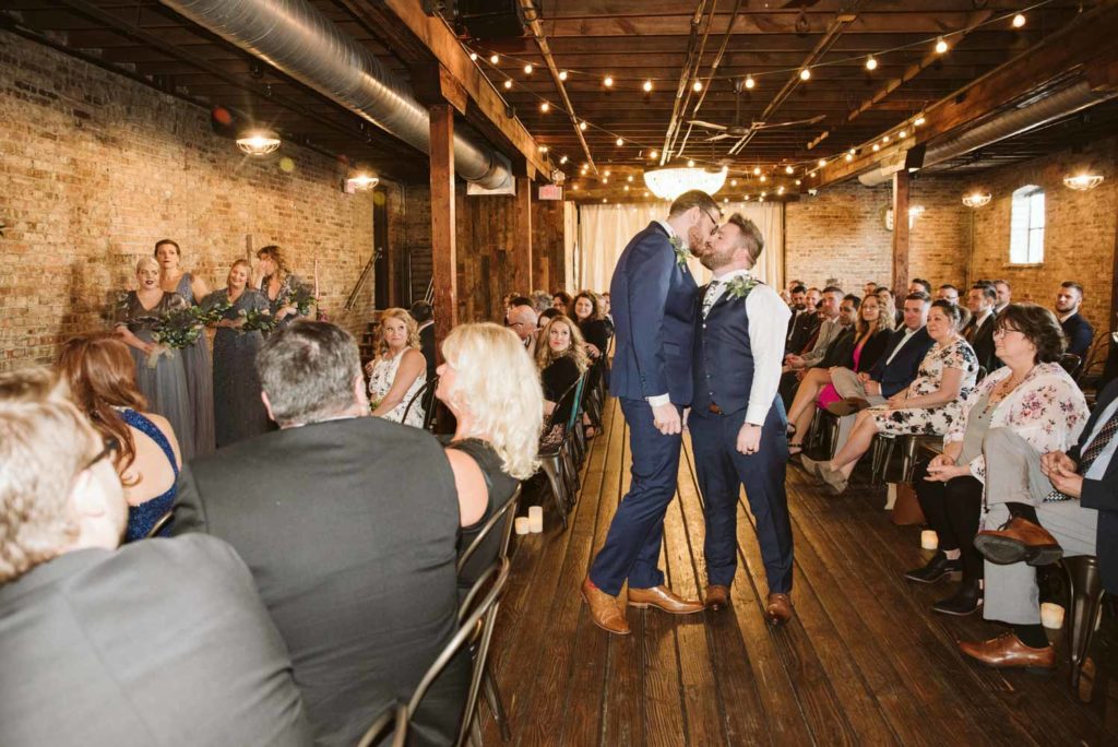 David + Andrew: Midwestern Pride Wedding Giveaway winners marry Photo Glass & Grain Photography published on Equally Wed gay grooms kiss