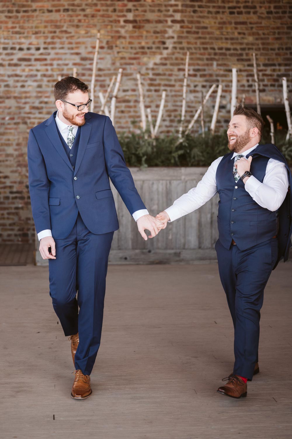 two grooms blue suits David + Andrew: Midwestern Pride Wedding Giveaway winners marry Photo Glass & Grain Photography published on Equally Wed