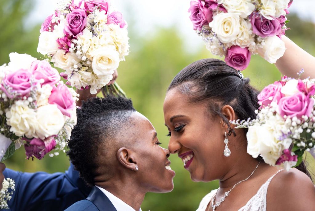 couple kiss purple outdoor New Jersey Black LGBTQ+ wedding
