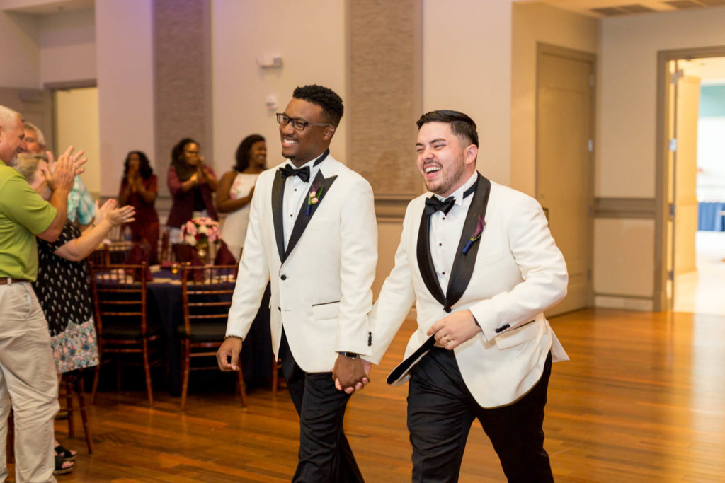 Tavion + Andrew: A Greenville, South Carolina, summer LGBTQ+ wedding grooms entering reception