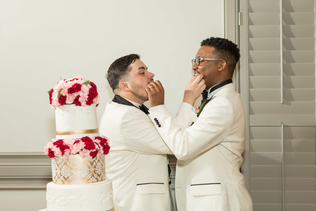 Tavion + Andrew: A Greenville, South Carolina, summer LGBTQ+ wedding cake cutting