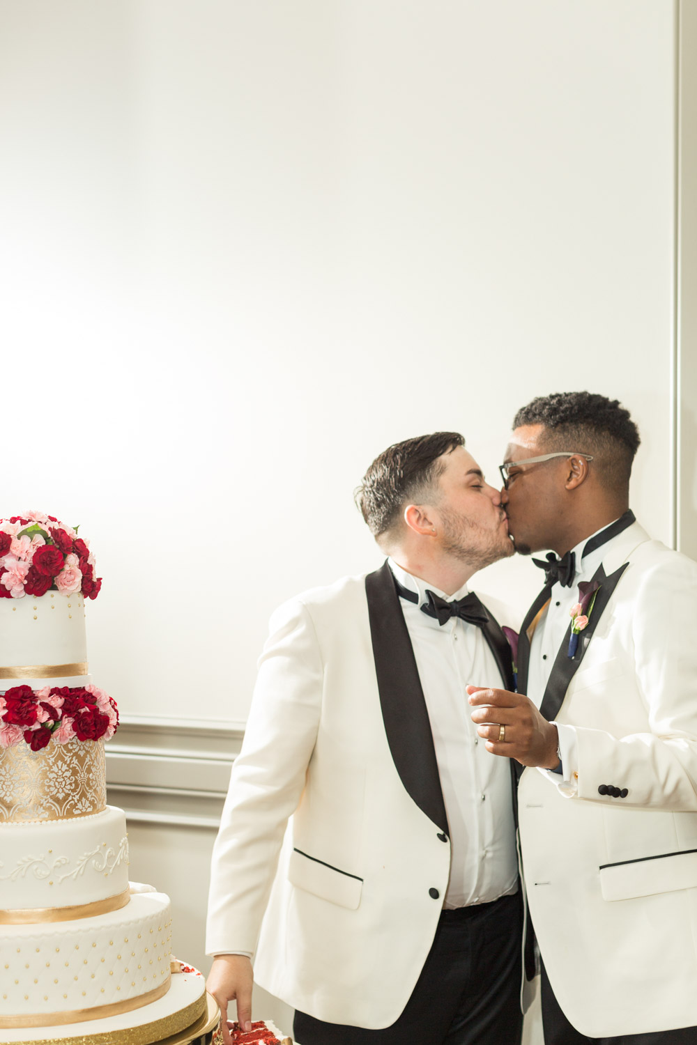 Tavion + Andrew: A Greenville, South Carolina, summer LGBTQ+ wedding cake cutting
