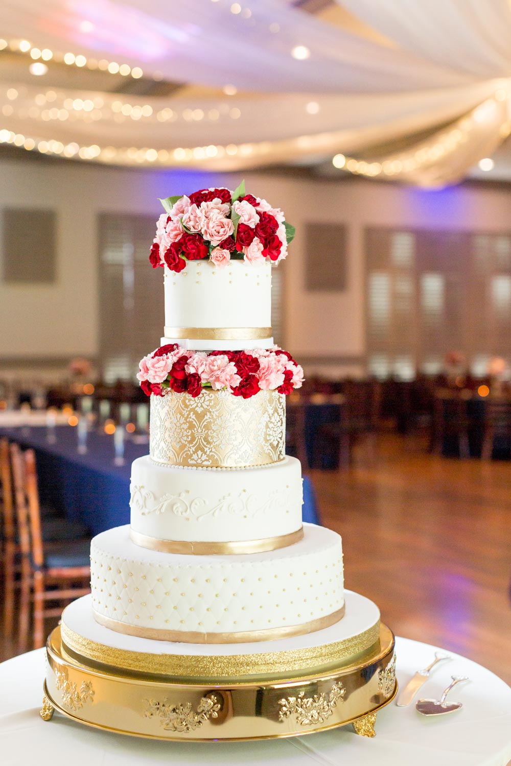 Tavion + Andrew: A Greenville, South Carolina, summer LGBTQ+ wedding with rose petal exit reception pink red gold wedding cake 