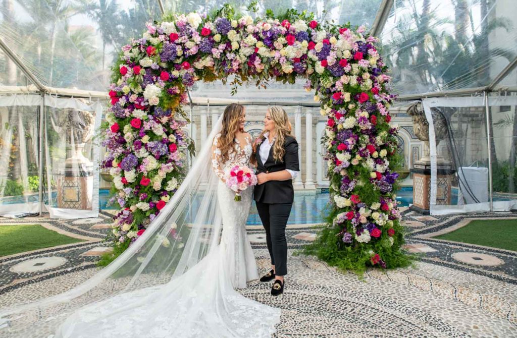 Angelina + Krista: Upscale glamorous lesbian wedding at the renowned Versace mansion in Miami Beach, Florida Suzanne Delawar Studios newlywed portrait