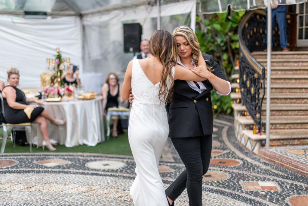Angelina + Krista: Upscale glamorous lesbian wedding at the renowned Versace mansion in Miami Beach, Florida Suzanne Delawar Studios first dance