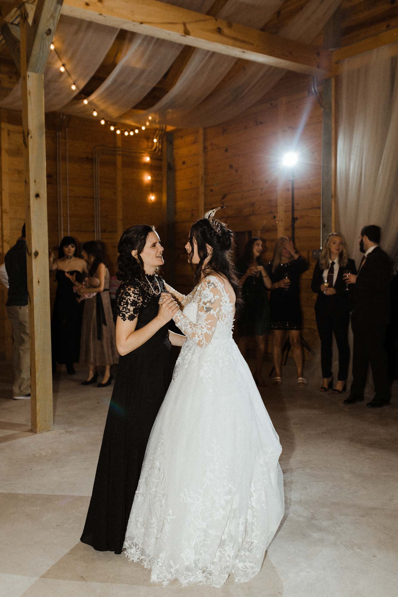 Beautifully gothic Texas wedding with creative details, photo by Leah Thomason Photography, featured on Equally Wed, the LGBTQ+ wedding magazine barn outdoor wedding reception