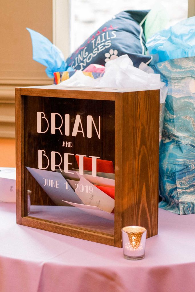 LGBTQ+ wedding featured on Equally Wed magazine with two grooms Brian + Brett: Hudson Valley garden wedding with shades of purple Upasana Mainali Photography gift table with personalized envelope card box