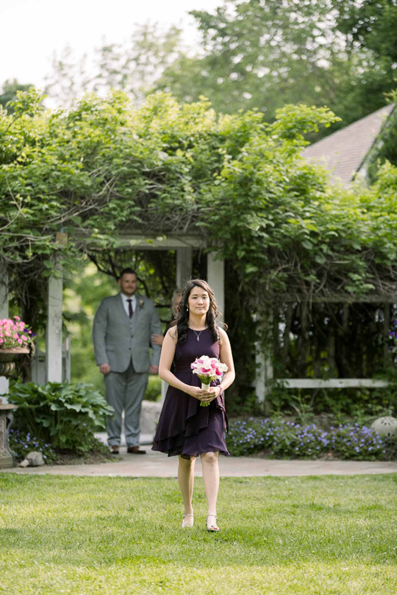 processional groomsmaid in purple dress LGBTQ+ wedding featured on Equally Wed magazine with two grooms Brian + Brett: Hudson Valley garden wedding with shades of purple Upasana Mainali Photography outdoor wedding ceremony