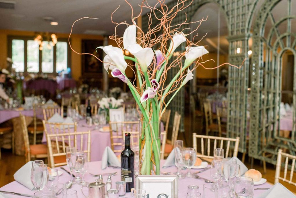 calla lily centerpieces reception pink linen tablecloth LGBTQ+ wedding featured on Equally Wed magazine with two grooms Brian + Brett: Hudson Valley garden wedding with shades of purple Upasana Mainali Photography outdoor wedding ceremony