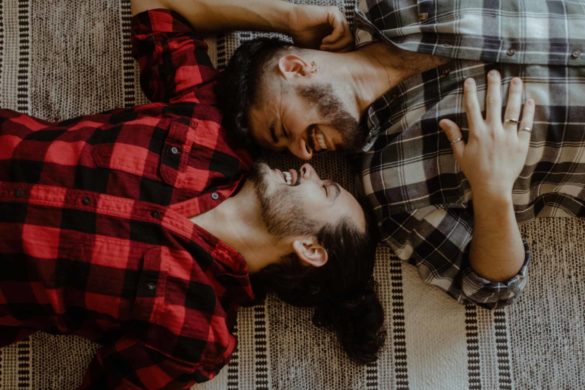 Iowa home photoshoot turned Christmas engagement feature on Equally Wed, the LGBTQ+ wedding magazine. Photo by Silk & Thorn. keywords: gay, engayged, Buffalo plaid shirts, fireplace, Christmas proposal, men in love