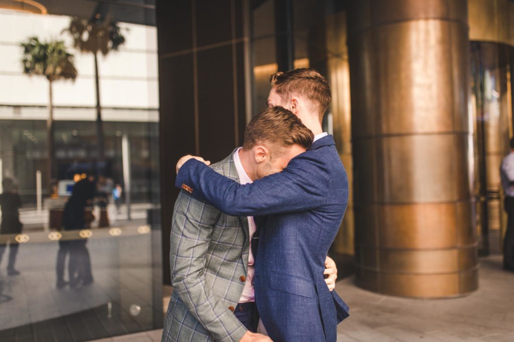 After a four-month engagement, Joel and Thomas married in a Sydney, Australia, microwedding. Photo by Chris Gray Photomedia. Published on Equally Wed, the world's leading LGBTQ+ wedding magazine and wedding directory of LGBTQ+ inclusive wedding vendors and venues. pictured: first look