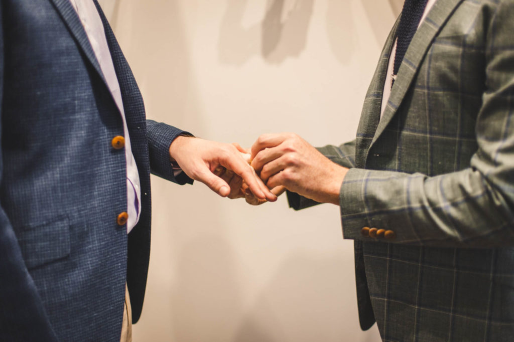 After a four-month engagement, Joel and Thomas married in a Sydney, Australia, microwedding. Photo by Chris Gray Photomedia. Published on Equally Wed, the world's leading LGBTQ+ wedding magazine and wedding directory of LGBTQ+ inclusive wedding vendors and venues. pictured: ring exchange