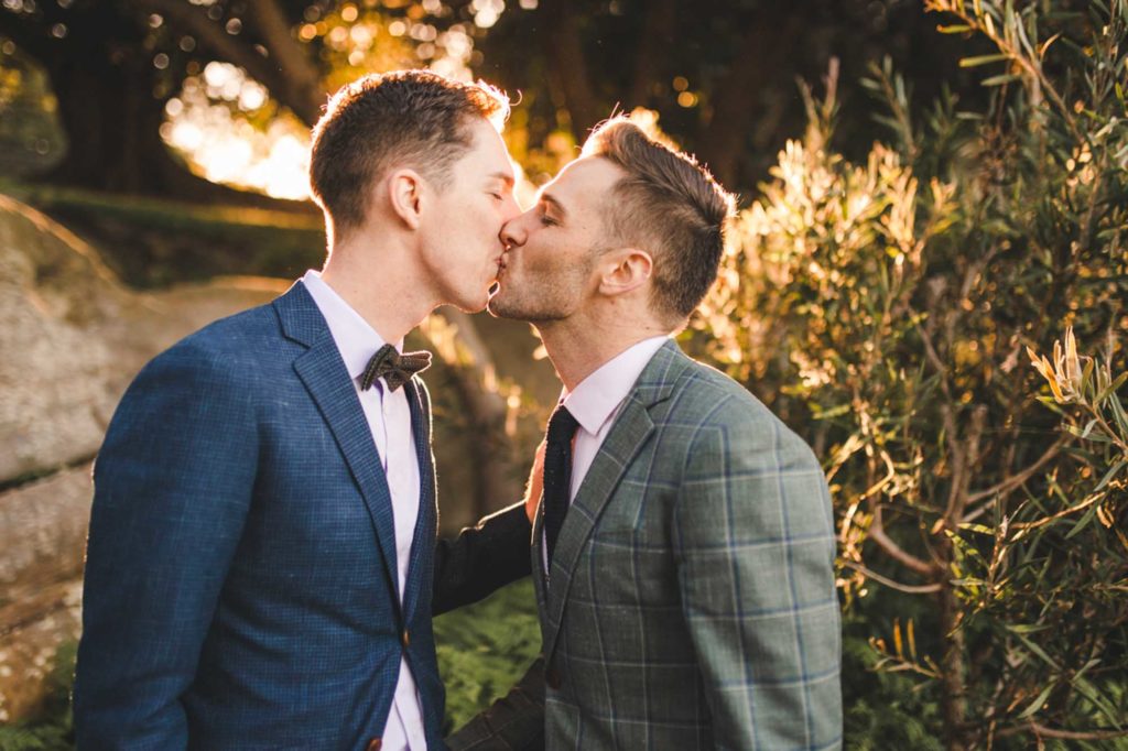 After a four-month engagement, Joel and Thomas married in a Sydney, Australia, microwedding. Photo by Chris Gray Photomedia. Published on Equally Wed, the world's leading LGBTQ+ wedding magazine and wedding directory of LGBTQ+ inclusive wedding vendors and venues. pictured: two grooms kiss