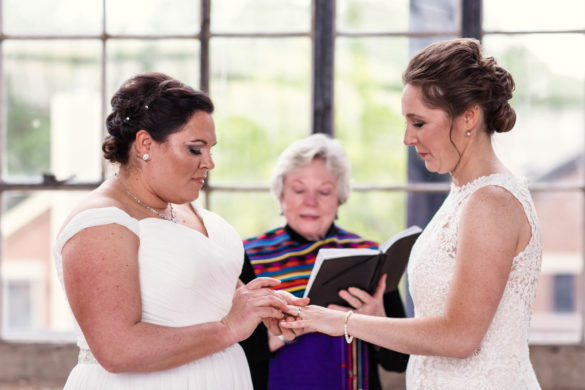 Colorful summer wedding at Chicago's Ravenswood Event Center two brides ceremony exchanging vows