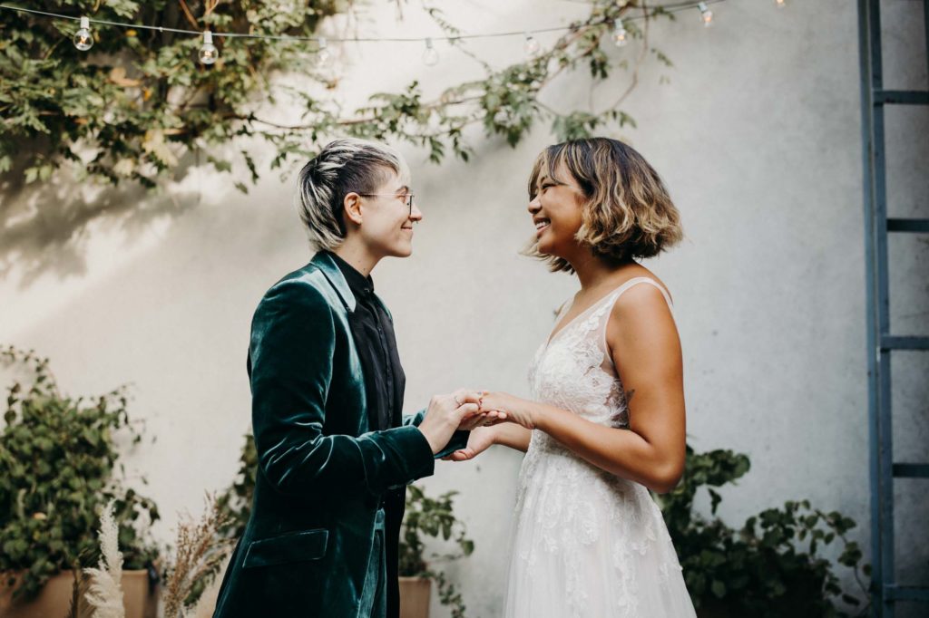 Outdoor Brooklyn microwedding styled shoot | Photography by Lucie B Photography | Featured on Equally Wed, the world's leading LGBTQ+ wedding magazine | LGBTQ+ marriers exchanging rings