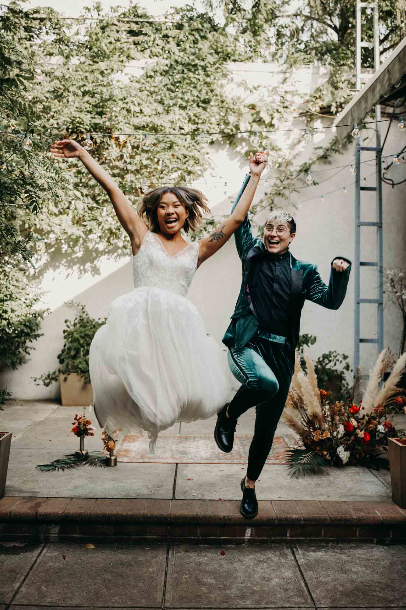 Outdoor Brooklyn microwedding styled shoot | Photography by Lucie B Photography | Featured on Equally Wed, the world's leading LGBTQ+ wedding magazine | LGBTQ+ marriers jump for joy after saying I do