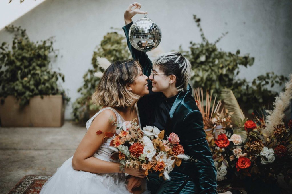 Outdoor Brooklyn microwedding styled shoot | Photography by Lucie B Photography | Featured on Equally Wed, the world's leading LGBTQ+ wedding magazine | LGBTQ+ couple celebrating their wedding with mirror disco ball