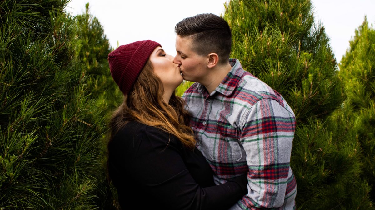 Casual and joyous engagement session at a California Christmas tree farm