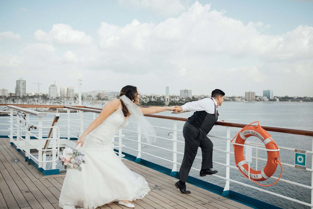 Cruise wedding with attendants in dusty rose gowns and brown suits | Toni G Photo | Featured on Equally Wed, the leading LGBTQ+ wedding magazine